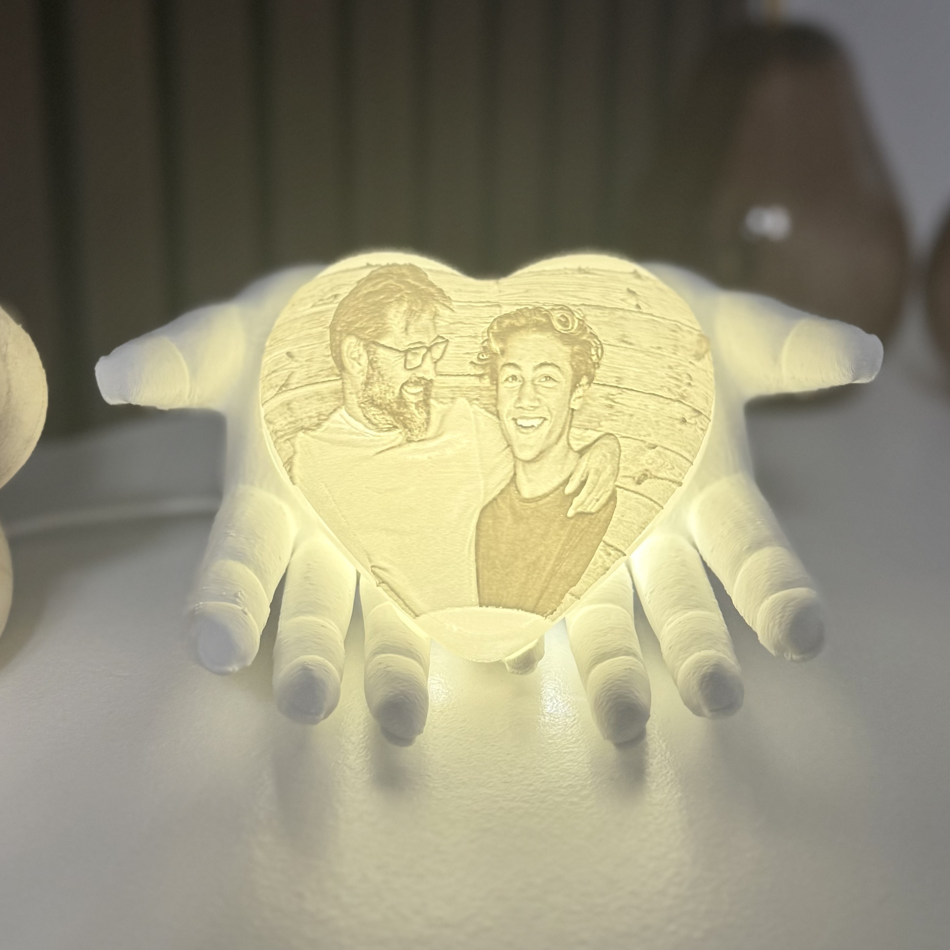 memorial heart photo light with hands