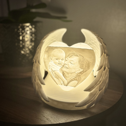 memorial light with wings and a heart shaped photo with photo UK